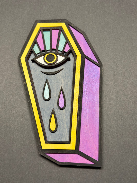 Coffin with crying eye